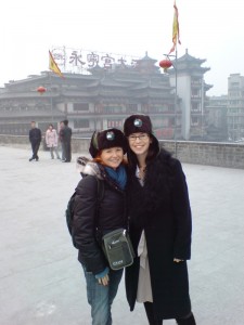 On the old city wall in Xian, with fellow teacher, each sporting the 'trip hat'
