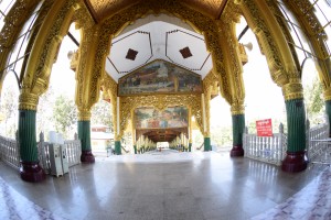 The archway of the temple. Paintings show the making and transportation of the marble Buddha