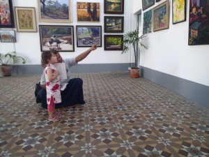 Tali getting a tour of the gallery from our guide