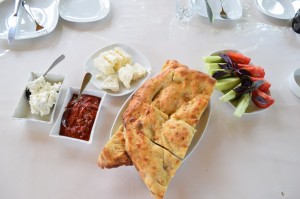 Bread, cheese, vegetables and tomato paste.  A delicious meal. Every time. 